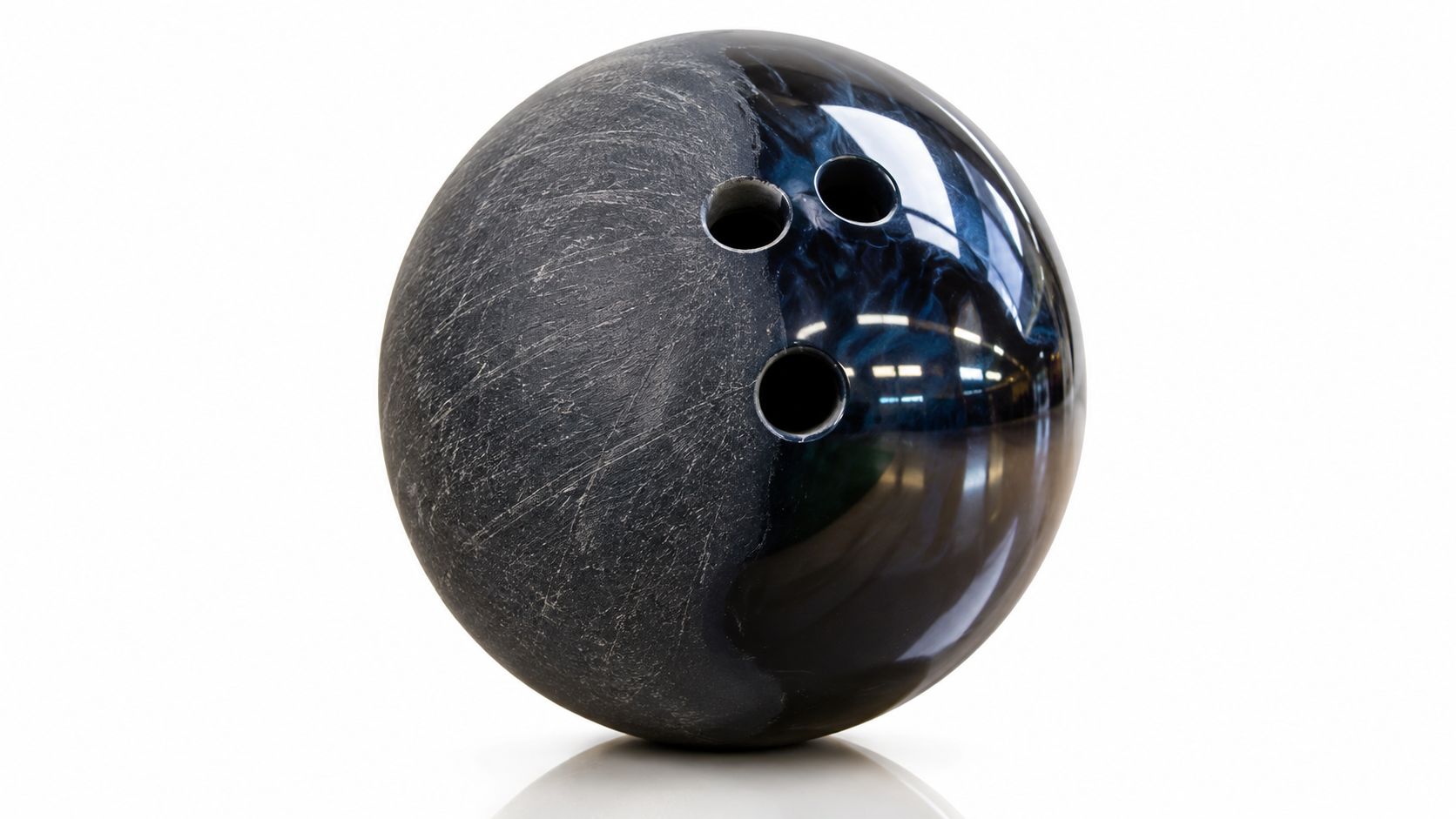 A dual-texture bowling ball with a matte grey side and a glossy, dark marbled blue side.